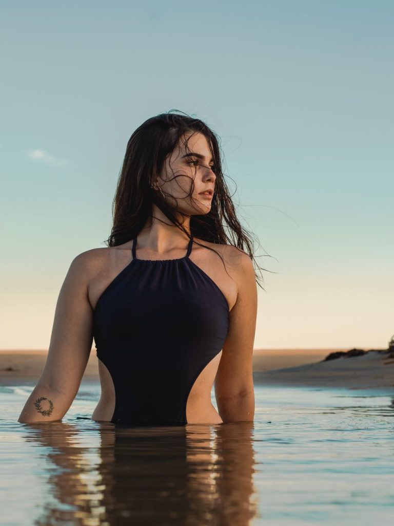 Woman in a bikini by the water
